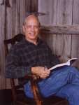 Campbell relaxes in front of a fake barn door.