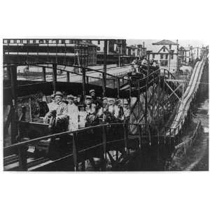 Roller coaster,Coney Island,New York Harbor,N.Y.,people riding 