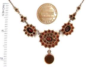 This necklace is set with 52 genuine facetted rosecut garnets