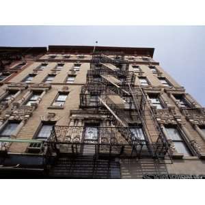  Up at an East Village Apartment Building with Fire Escapes, New York 