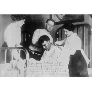  early 1900s photo Dr. James F. Grant, ships surgeon, fixing Gordon 