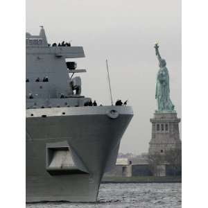  USS New York Passes the Statue of Liberty While Fireboats 