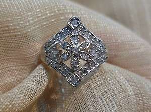 Ladies 10k white gold diamond flower estate looking ring size 6  