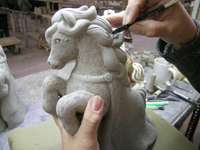 Each figurine is carved by hand; no two subjects are ever carved 