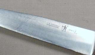   of five vintage kitchen knives. Below is a brief description of each