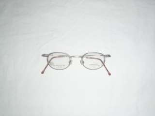 NEOSTYLE EYEGLASS FRAME. STAINLESS STEEL IN A BRUSHED GOLD ROUND 