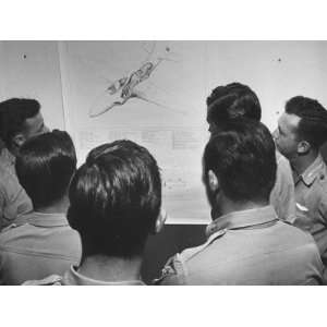 Group of Conventional Fighter Pilots Studying a Chart of the P 80 