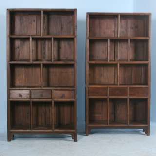   these matching bookcases have four shelves and three pull out drawers