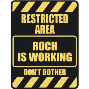   RESTRICTED AREA ROCH IS WORKING  PARKING SIGN