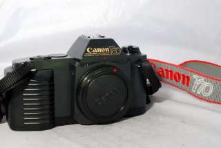 Canon T50 camera body only with battery door damaged but works  