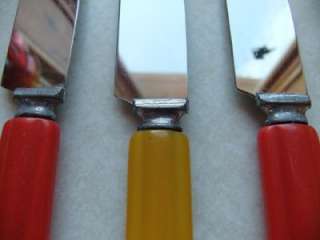 Vintage set of butterscotch and red, bakelite forks, spoons and knives 