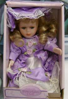 COLLECTIBLE BISQUE PORCELAIN DOLL WITH SIMULATED PEARLS  