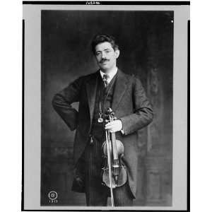 Fritz Kreisler,holding violin,bow in left hand,c1913
