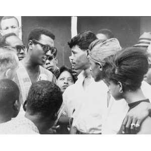  1966 Stokely Carmichael (left) in sunglasses and a striped 