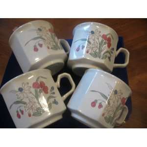  Four Stoneware Flower Designed Mugs 