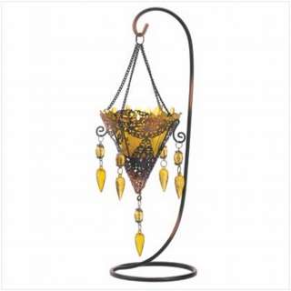 dripping with lace and dazzling gems this ornate candleholder recalls