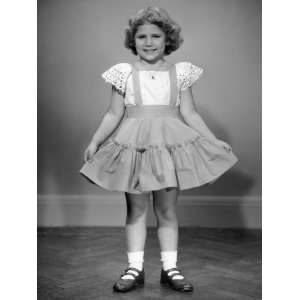  Little Girl Holding Her Ruffled Skirt Out Photographic 